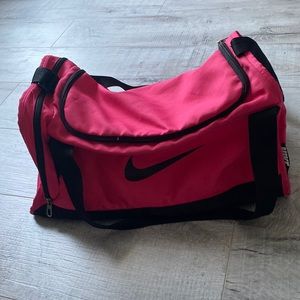 Hot pink Nike sports duffel bag
